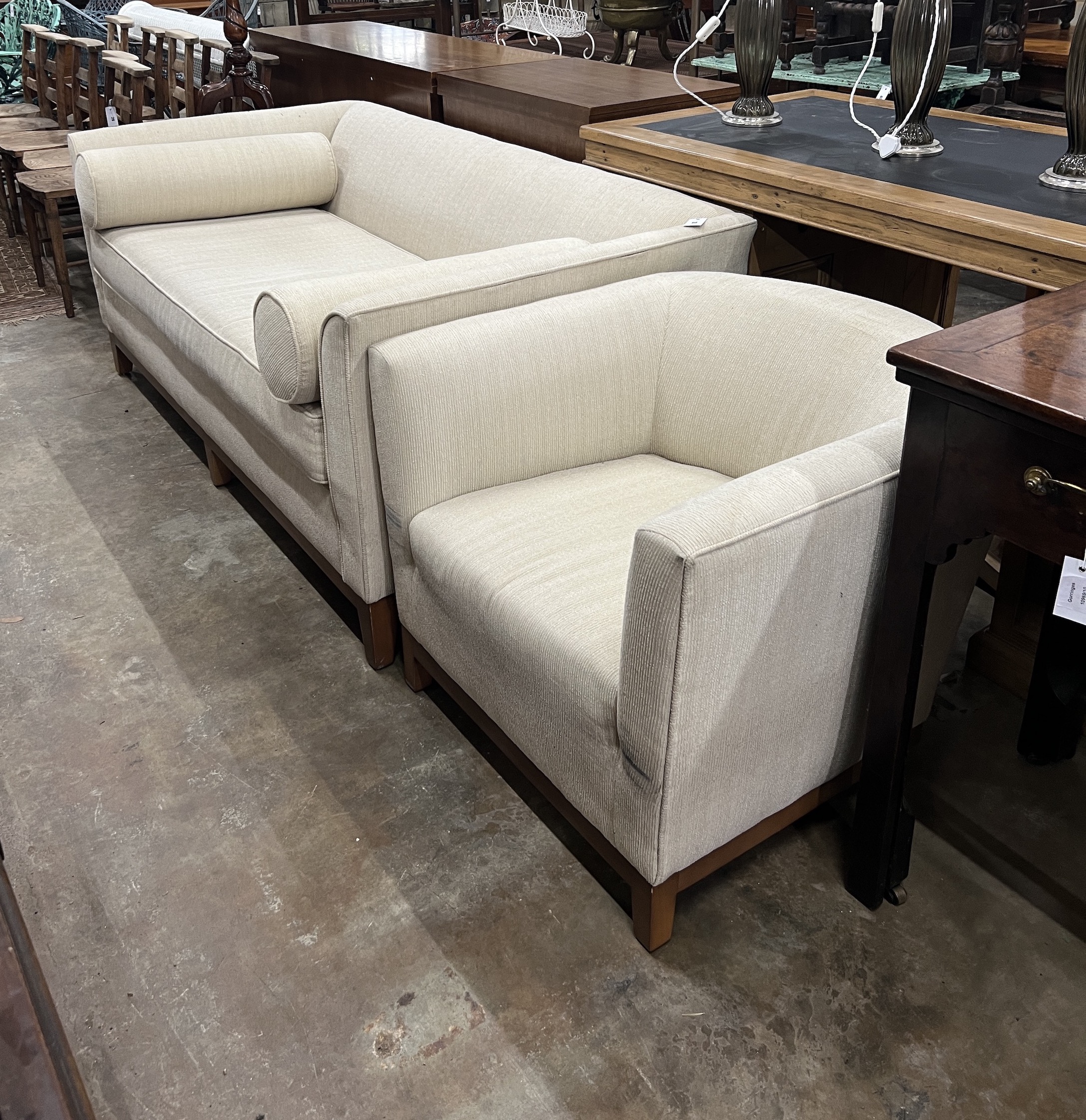 A contemporary three seater sofa, length 180cm, depth 91cm, height 72cm and similar tub armchair